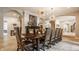 Elegant dining room featuring a long wooden table, comfortable seating, and arched doorways at 110 Bow Ln, Indianapolis, IN 46220