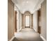 Inviting hallway featuring beautiful wood doors and neutral tones for a classic look at 110 Bow Ln, Indianapolis, IN 46220