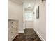 Hallway featuring hardwood floors, a vintage dresser, and natural light at 110 Bow Ln, Indianapolis, IN 46220