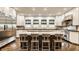 Spacious kitchen featuring double islands with seating, custom cabinets, and stainless steel appliances at 110 Bow Ln, Indianapolis, IN 46220