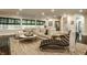 Bright living room with large windows, comfortable seating, and hardwood floors at 110 Bow Ln, Indianapolis, IN 46220