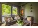Screened in porch featuring a view of lush greenery and trees at 110 Bow Ln, Indianapolis, IN 46220