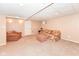 Finished basement featuring neutral carpet and walls, offering a cozy and versatile space for relaxation and entertainment at 11820 Stepping Stone Dr, Fishers, IN 46037