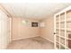 Neutral bedroom featuring carpeted floors, paneled ceiling, and large window at 11820 Stepping Stone Dr, Fishers, IN 46037