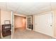 Spacious bedroom featuring carpeted floors, paneled ceiling, and walk-in closet at 11820 Stepping Stone Dr, Fishers, IN 46037