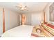 Spacious bedroom with a view to an upstairs hallway, neutral colors, and large closet at 11820 Stepping Stone Dr, Fishers, IN 46037