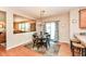 Charming dining area with a view to the living room, wood floors, and natural light is perfect for meals at 11820 Stepping Stone Dr, Fishers, IN 46037