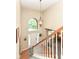 Bright foyer with high ceilings, a staircase, a front door with large windows, and a chandelier at 11820 Stepping Stone Dr, Fishers, IN 46037