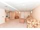 Comfortable living room featuring a plush floral sofa and a red patterned ottoman, perfect for relaxation at 11820 Stepping Stone Dr, Fishers, IN 46037