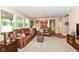 Spacious living room showcasing natural light with easy access to the kitchen and hardwood floors at 11820 Stepping Stone Dr, Fishers, IN 46037