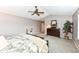 A tranquil main bedroom with plush carpet, a large bed, and a dark wood dresser at 11820 Stepping Stone Dr, Fishers, IN 46037