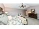 Spacious main bedroom with soft carpet, a large bed, and traditional wooden furniture at 11820 Stepping Stone Dr, Fishers, IN 46037