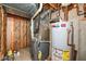 Unfinished basement utility room contains hot water tank, furnace, and plumbing at 11820 Stepping Stone Dr, Fishers, IN 46037
