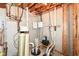 Unfinished basement utility room featuring concrete floors and walls, plumbing, and electrical equipment at 11820 Stepping Stone Dr, Fishers, IN 46037