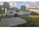 A view of the home's backyard, featuring a lawn, fenced area, and white siding at 1201 E Gimber St, Indianapolis, IN 46203