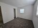 Bright bedroom with neutral carpet, window, closet, and crisp, clean white walls at 1201 E Gimber St, Indianapolis, IN 46203