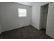 Bright bedroom with neutral carpet, window, and crisp, clean white walls at 1201 E Gimber St, Indianapolis, IN 46203