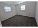 Bright bedroom with neutral carpet, window, and crisp, clean white walls at 1201 E Gimber St, Indianapolis, IN 46203