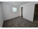 Bright bedroom with neutral carpet, window, closet, and crisp, clean white walls at 1201 E Gimber St, Indianapolis, IN 46203