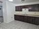 Functional kitchen with dark wood cabinets at 1201 E Gimber St, Indianapolis, IN 46203