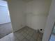 A utility area with white walls and tile floor, ready for laundry equipment and extra storage at 1201 E Gimber St, Indianapolis, IN 46203