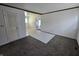 A bright living room with carpet, perfect for relaxation and entertainment at 1201 E Gimber St, Indianapolis, IN 46203