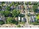 Aerial view of a neighborhood street with well-maintained houses, showcasing a mix of architectural styles and tree-lined streets at 1405 E Vermont St, Indianapolis, IN 46201