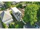Aerial view of the modern home with rooftop deck and fenced backyard at 1405 E Vermont St, Indianapolis, IN 46201