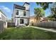 View of the home's backyard with seating and outdoor grill at 1405 E Vermont St, Indianapolis, IN 46201