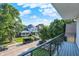 Neighborhood street view from a balcony, showcasing homes and lush green trees at 1405 E Vermont St, Indianapolis, IN 46201
