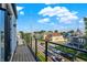 Balcony view of a neighborhood street with parked cars and diverse architectural styles at 1405 E Vermont St, Indianapolis, IN 46201
