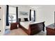 Comfortable bedroom with dark furniture and natural lighting at 1405 E Vermont St, Indianapolis, IN 46201