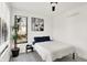 Bedroom with window and neutral decor at 1405 E Vermont St, Indianapolis, IN 46201