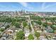 Expansive aerial view featuring a residential area leading to the city skyline, blending suburban charm and urban proximity at 1405 E Vermont St, Indianapolis, IN 46201