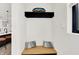 Entryway with a built-in bench, coat rack, and modern decor at 1405 E Vermont St, Indianapolis, IN 46201