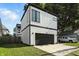 Modern home featuring a two-car garage and stylish exterior at 1405 E Vermont St, Indianapolis, IN 46201