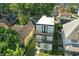 Aerial perspective of a modern three-story home, blending contemporary design with its natural surroundings and mature trees at 1405 E Vermont St, Indianapolis, IN 46201