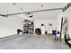This is a spacious garage with storage shelves and concrete flooring at 1405 E Vermont St, Indianapolis, IN 46201