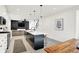 Open-concept kitchen with island seating, stainless steel appliances and access to the living room offers convenience at 1405 E Vermont St, Indianapolis, IN 46201