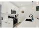 Bright kitchen features white cabinets and subway tile backsplash at 1405 E Vermont St, Indianapolis, IN 46201