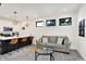 Cozy living room with a kitchen island, modern lighting, and comfortable seating area at 1405 E Vermont St, Indianapolis, IN 46201