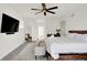Bright main bedroom with natural light and a comfortable king-size bed with nice decor at 1405 E Vermont St, Indianapolis, IN 46201