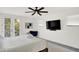 Comfortable main bedroom with a king bed, plush rug, a TV, and natural light at 1405 E Vermont St, Indianapolis, IN 46201