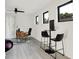 Modern office space with a desk, rolling chair, and a small bistro table with chairs at 1405 E Vermont St, Indianapolis, IN 46201