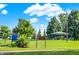 Scenic park view featuring lush green grass, mature trees, a covered picnic area, and walking paths for outdoor enjoyment at 1405 E Vermont St, Indianapolis, IN 46201