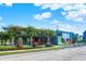 Exterior view of a unique restaurant with a colorful mural and outdoor seating, enhancing the vibrant local atmosphere at 1405 E Vermont St, Indianapolis, IN 46201