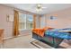 Cozy bedroom with a dark wood bed frame and a bright window view at 1449 Danielle Dr, Indianapolis, IN 46231