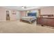 Bright bedroom with light walls, neutral carpet, fan, and large windows for natural light at 1449 Danielle Dr, Indianapolis, IN 46231