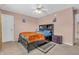 Cozy bedroom featuring a dark wood bed with drawers, neutral carpet, and soft, natural lighting at 1449 Danielle Dr, Indianapolis, IN 46231