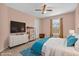 Nicely decorated bedroom featuring a large TV and ample natural light at 1449 Danielle Dr, Indianapolis, IN 46231